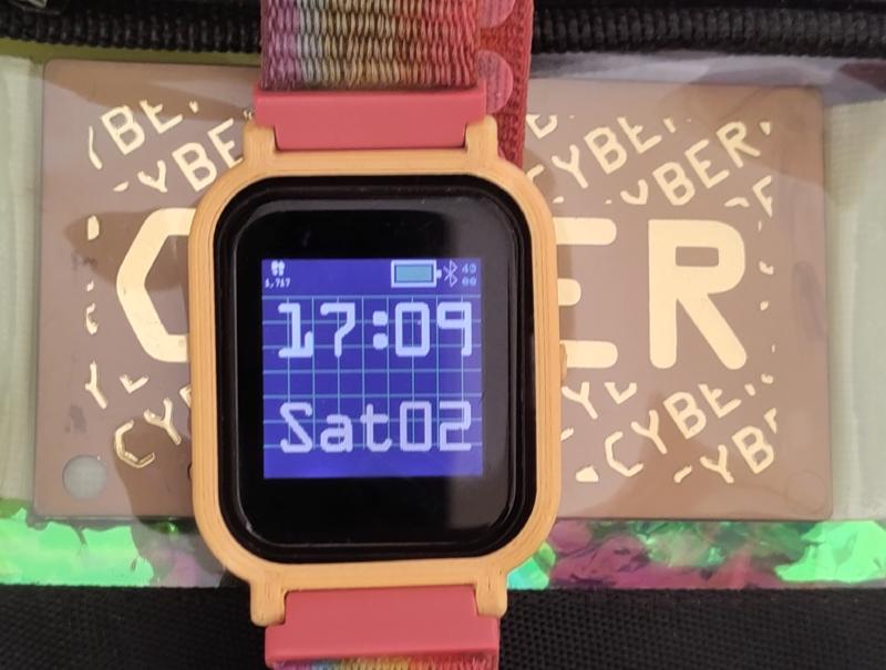 Bangle.js 2 watch showing the CYBERtime clock face